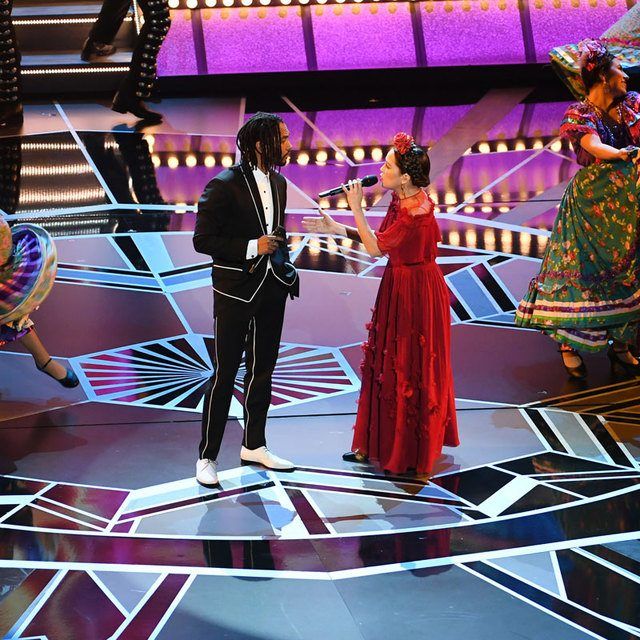 Singers Miguel (L) and Natalia Lafourcade perform onstage during the 90th Annual Academy Awards at the Dolby Theatre at Hollywood & Highland Center on March 4, 2018 in Hollywood, California. (Photo by Kevin Winter/Getty Images)